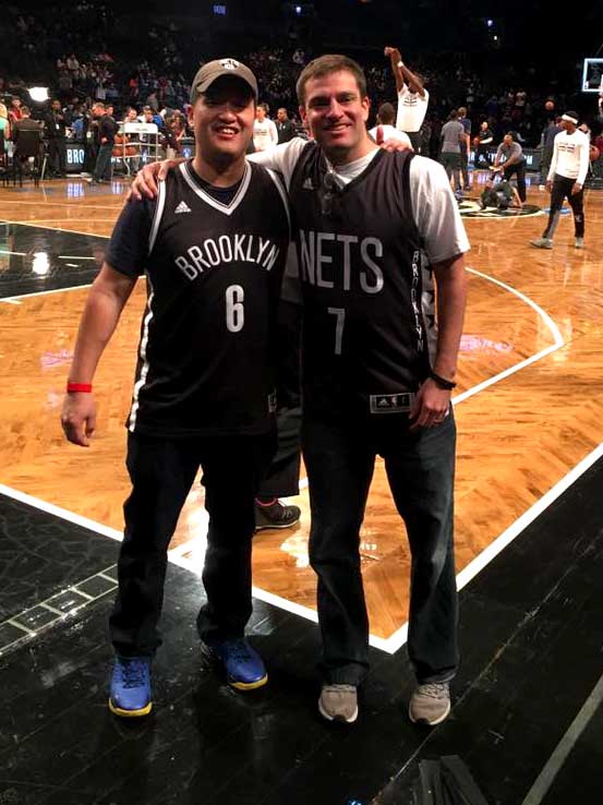 New York Rise founder Jeff Ahn, left, and Examiner Publisher Adam Stone, childhood friends from Port Washington, pictured here at a Nets game in March 2017. Ahn’s entrepreneurial journey was ignited after reading Nike Chairman Phil Knight’s 2016 memoir “Shoe Dog.”